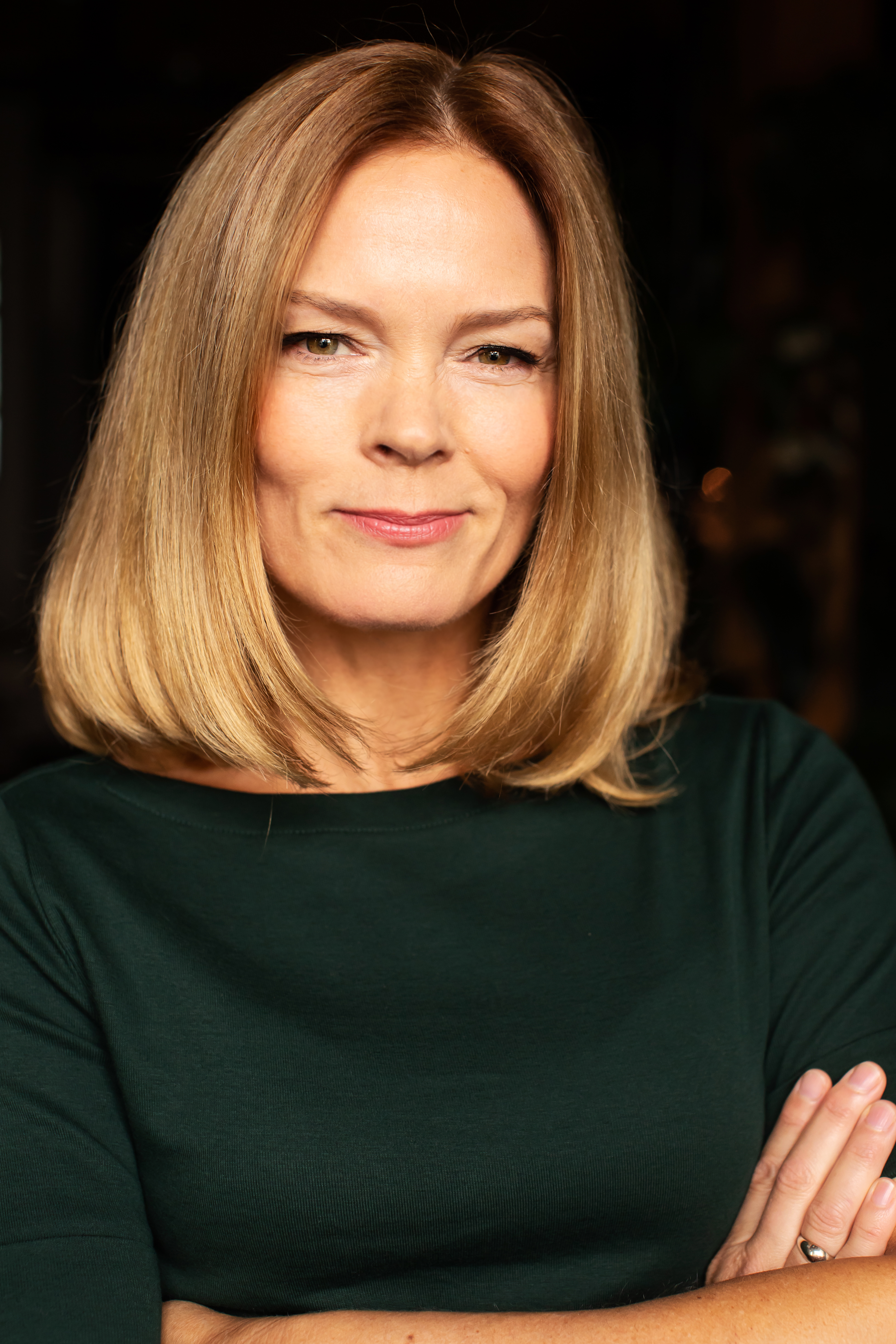 Megan Fahlenbock headshot green top